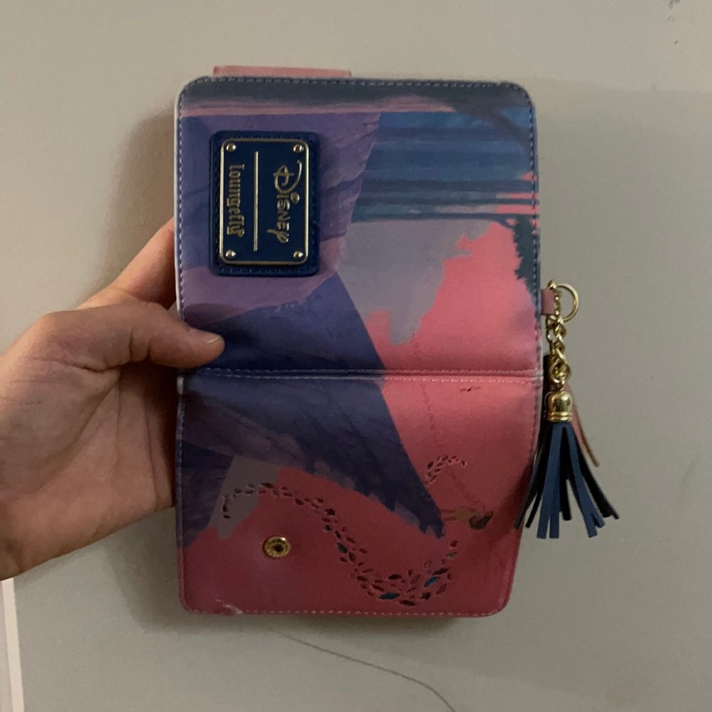 DisneyLoungeflyPocahontasWallet.Slight damage,worn edges,overall good condition